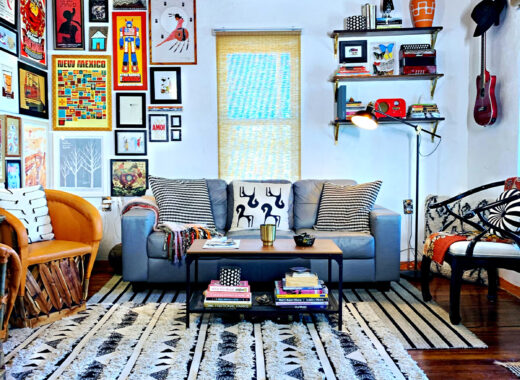 Eclectic Southwestern living room with corner gallery wall and shelf styling