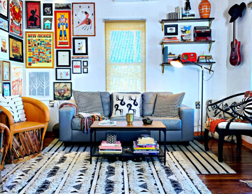 Eclectic Southwestern living room with corner gallery wall and shelf styling